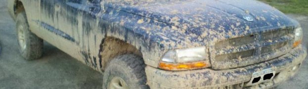Photo of the Week: rebeltaz83’s 2003 Dodge Dakota Covered in Mud