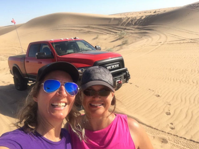 Nena Barlow (left) out teaching driver Tory Capezza how to drive in the dunes with the Ram Power Wagon.
