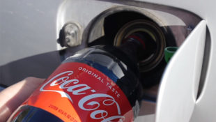 Pouring Coke into Gas Tank