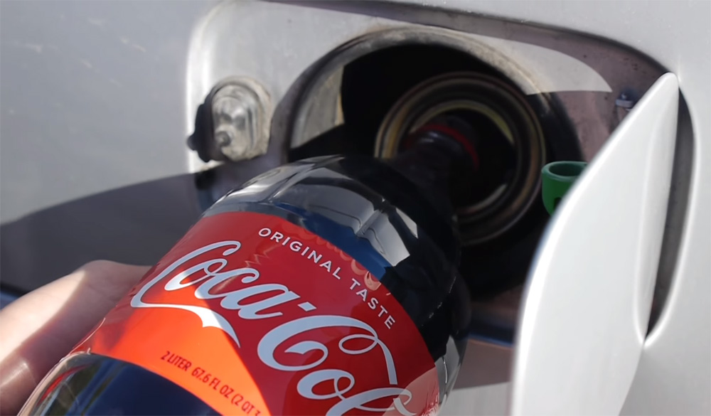Pouring Coke into Gas Tank