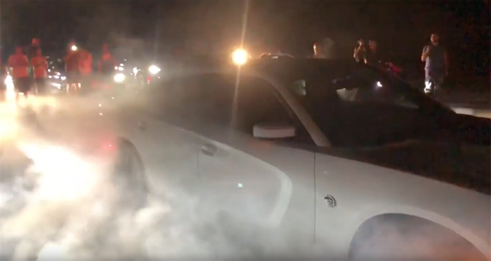 Charger Hellcat pulling a big burnout.