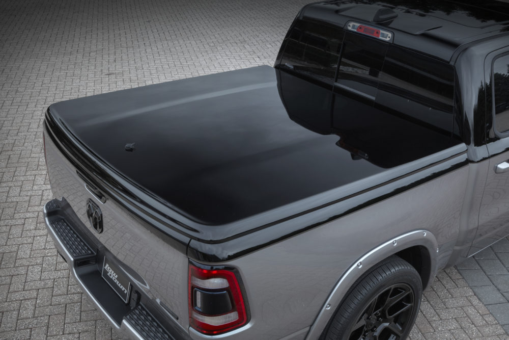 A one-piece Mopar hard tonneau cover in body color Gloss Black i