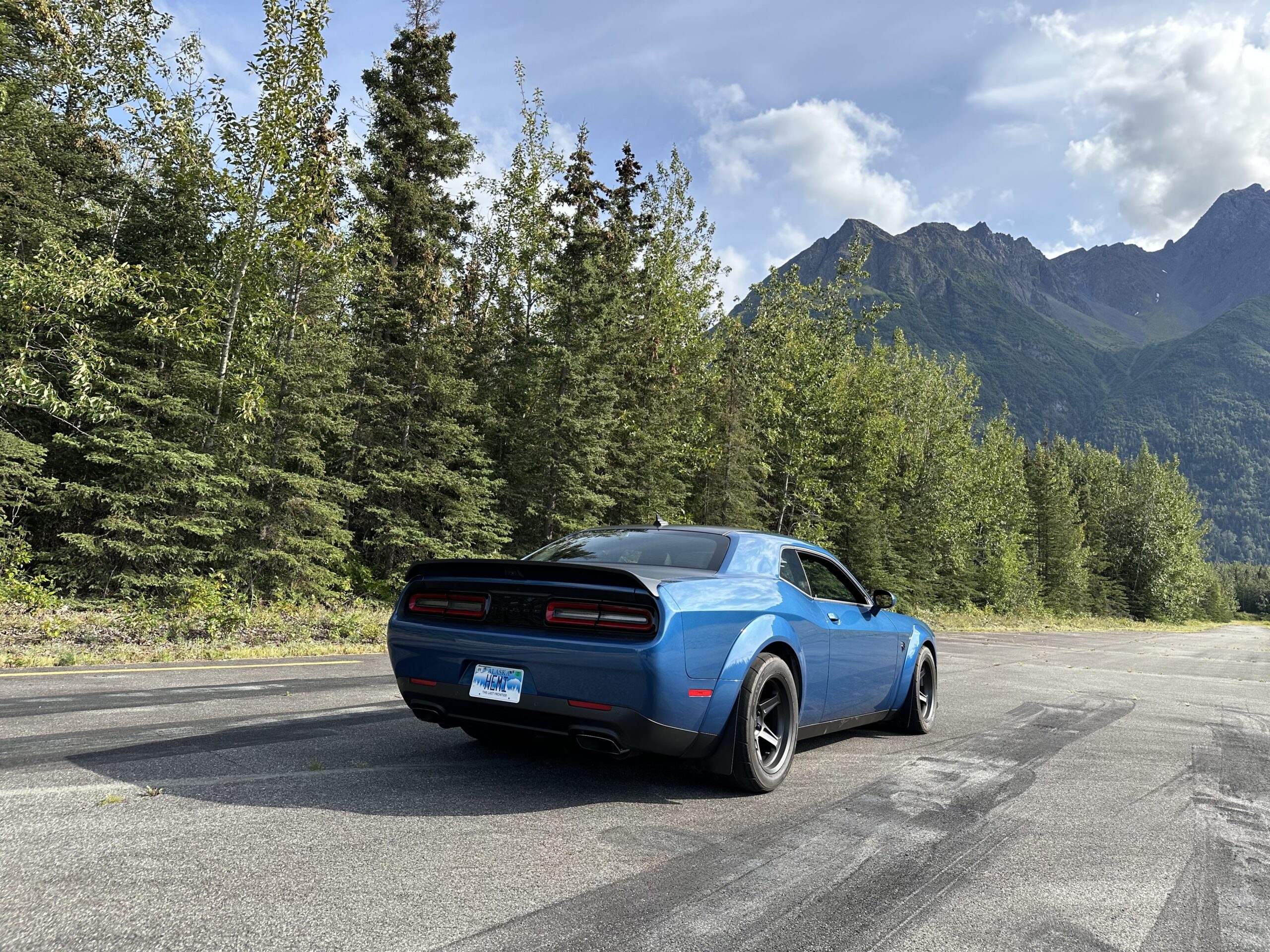 Sheldon Wilson's personal 2022 Dodge Challenger Super Stock at the end of the drag strip of Alaska Raceway Park